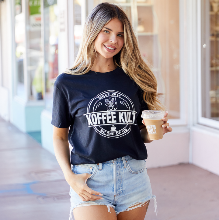 Be One of Us Shirt on Model at Cafe