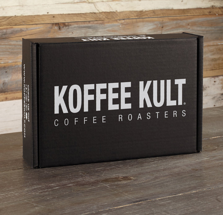 Koffee Kult gift box 2 x32oz and travel mug on table 2