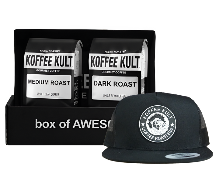 Koffee Kult coffee packages and a black cap with logo on a white background