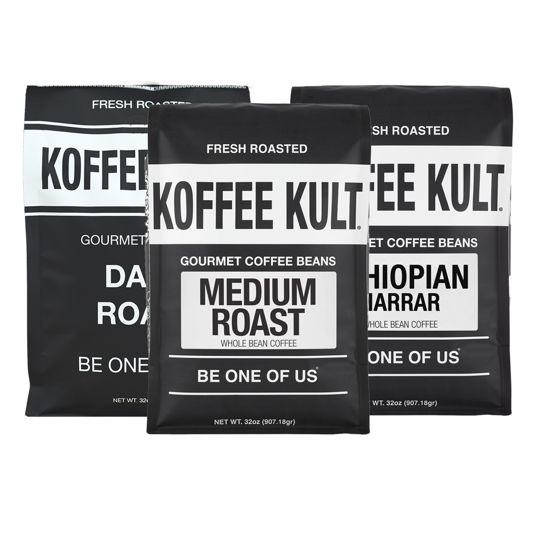 Three black coffee bean bags from Koffee Kult. Gourmet Coffee Beans arranged together on a plain white background, with labels for Dark Roast, Medium Roast, and Ethiopian Mararar.