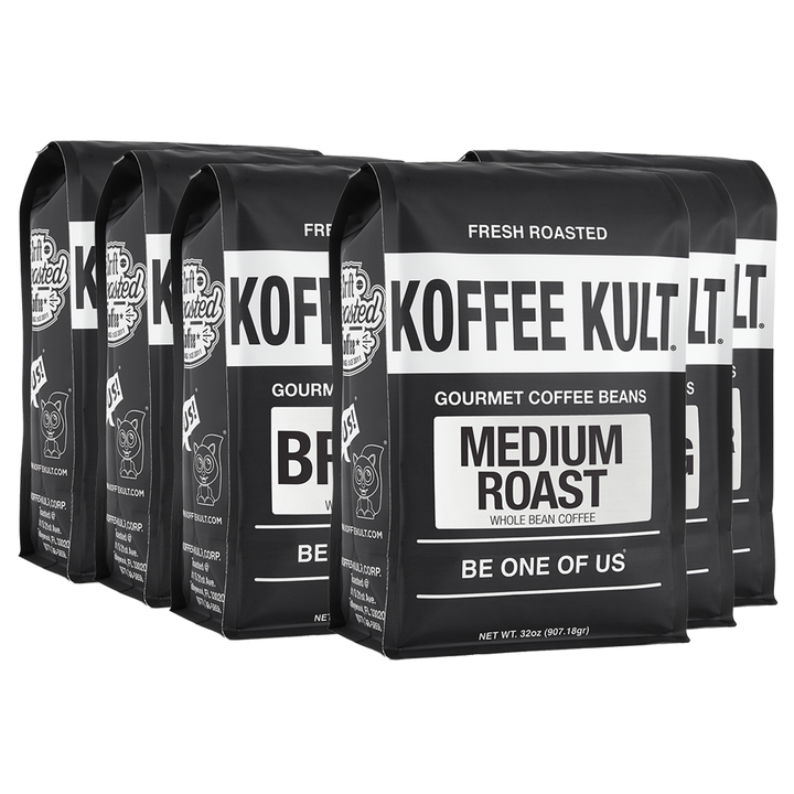 Five black bags of Koffee Kult. Gourmet Coffee Beans Medium Roast arranged in a row on a white background.