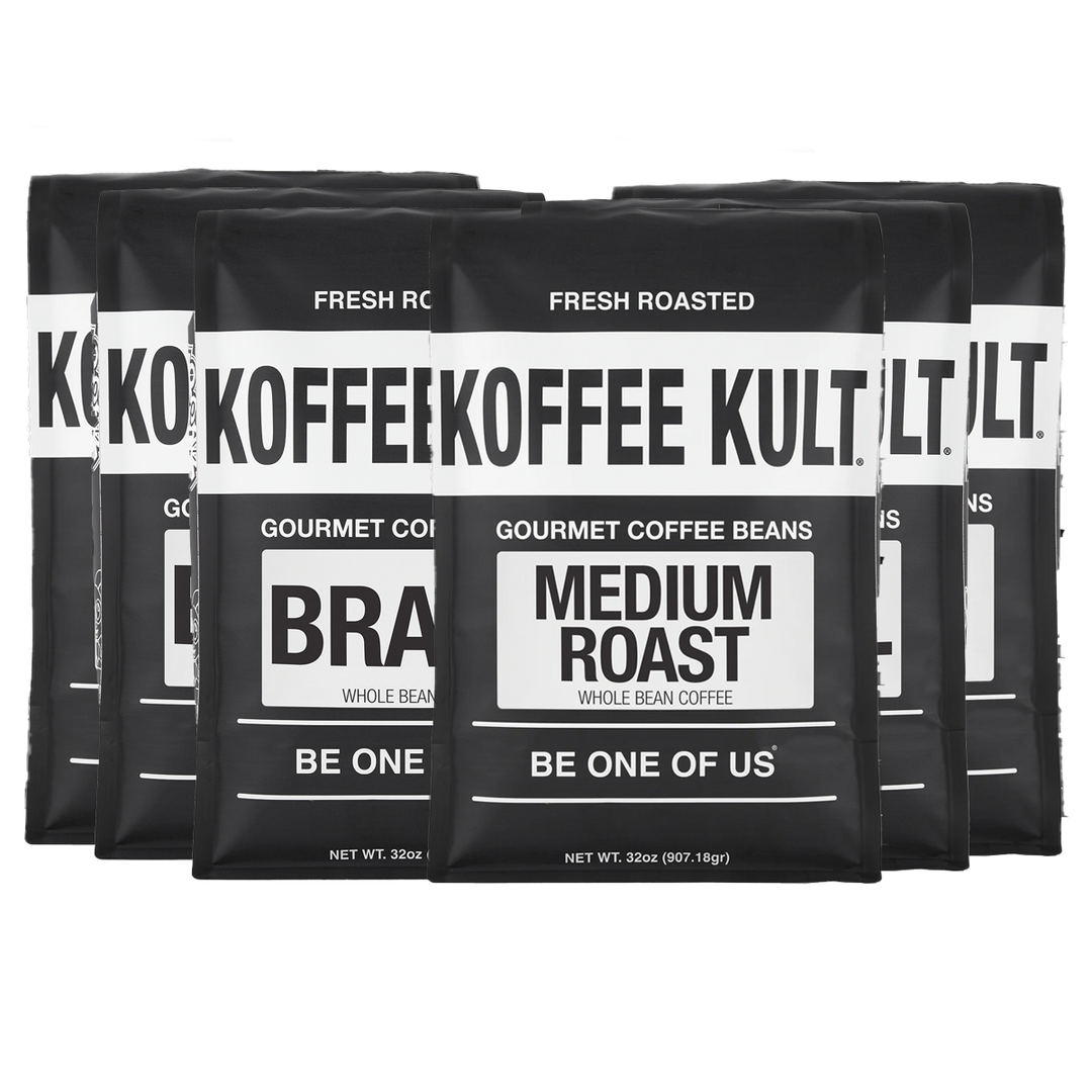 Five black bags of Koffee Kult Gourmet Coffee Beans, Medium Roast, arranged in a row against a white background.