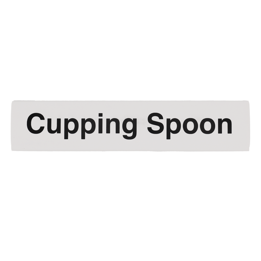 Rectangular white sign with 'Cupping Spoon' text on a white background