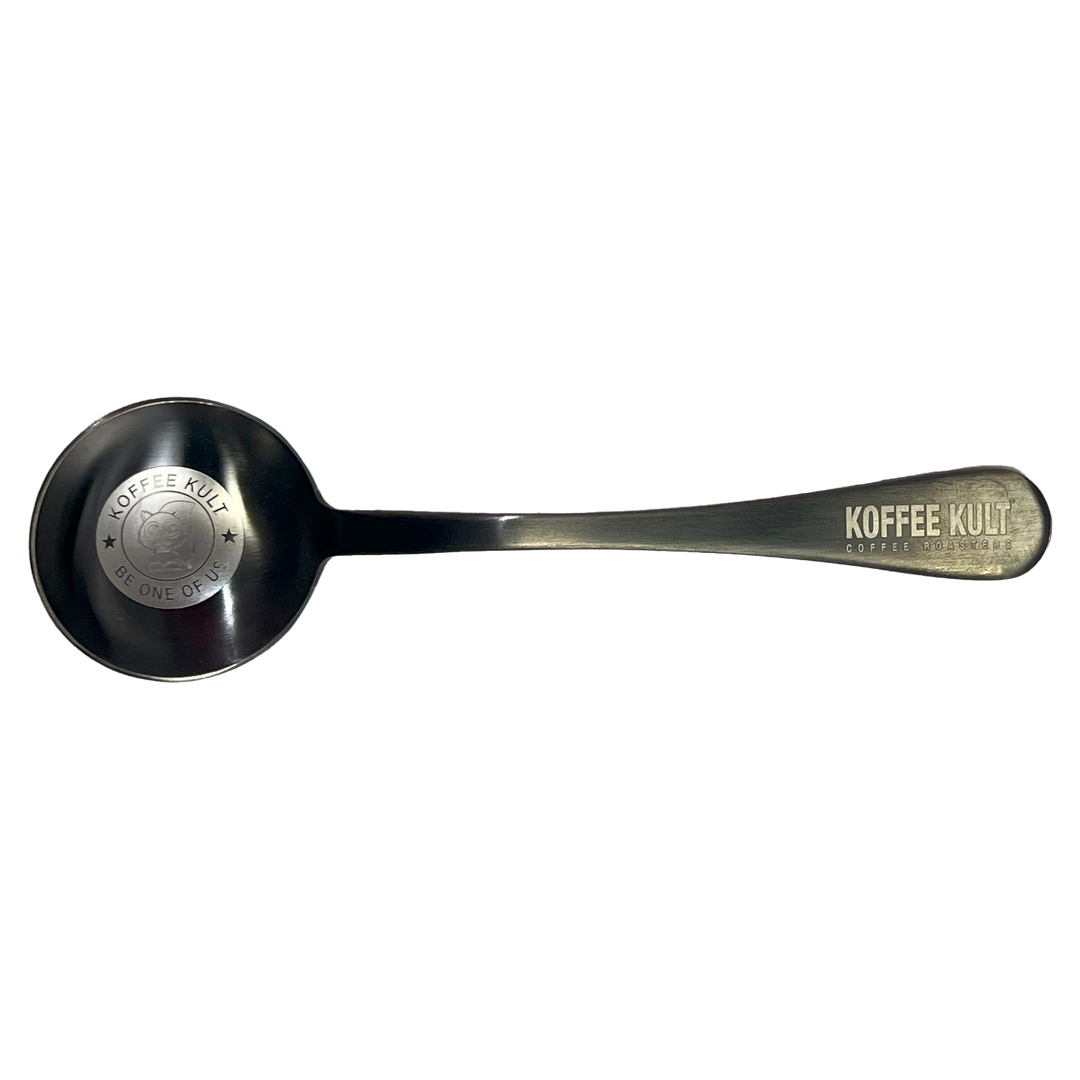 Stainless steel spoon with 'Koffee Kult' branding on a white background
