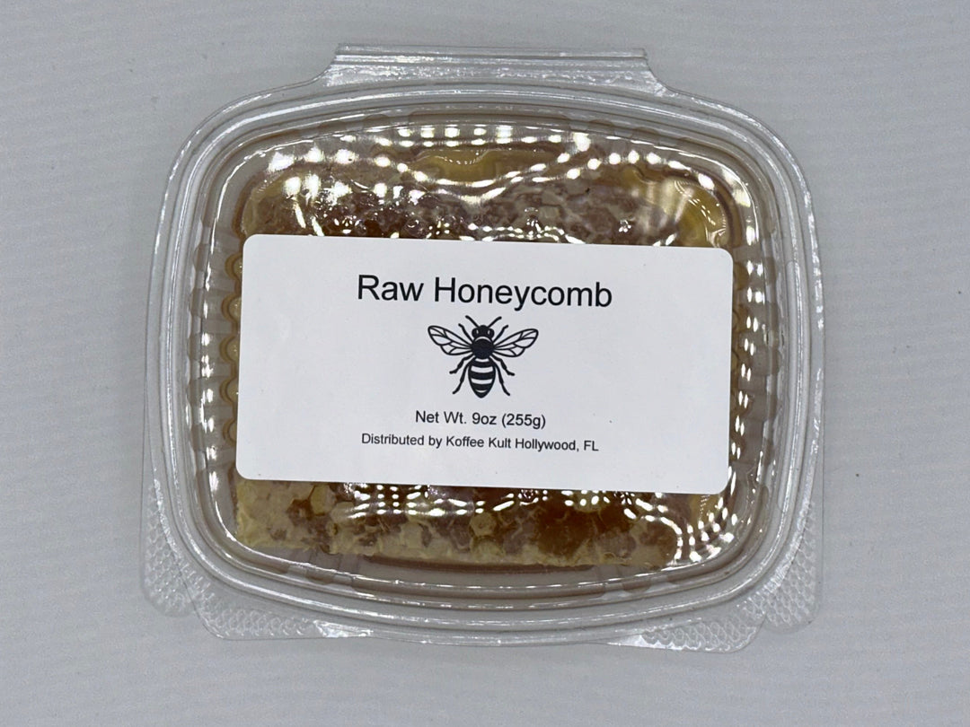 Packaged raw honeycomb with a label on a gray background