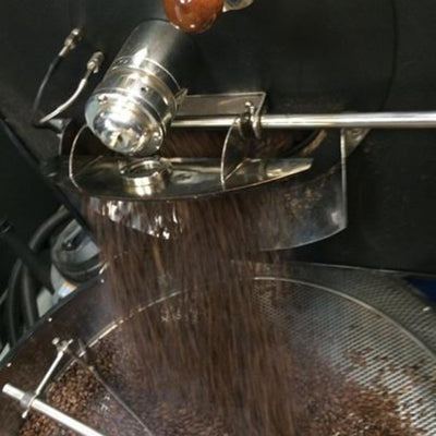 sumatra coffee e coming out of roaster